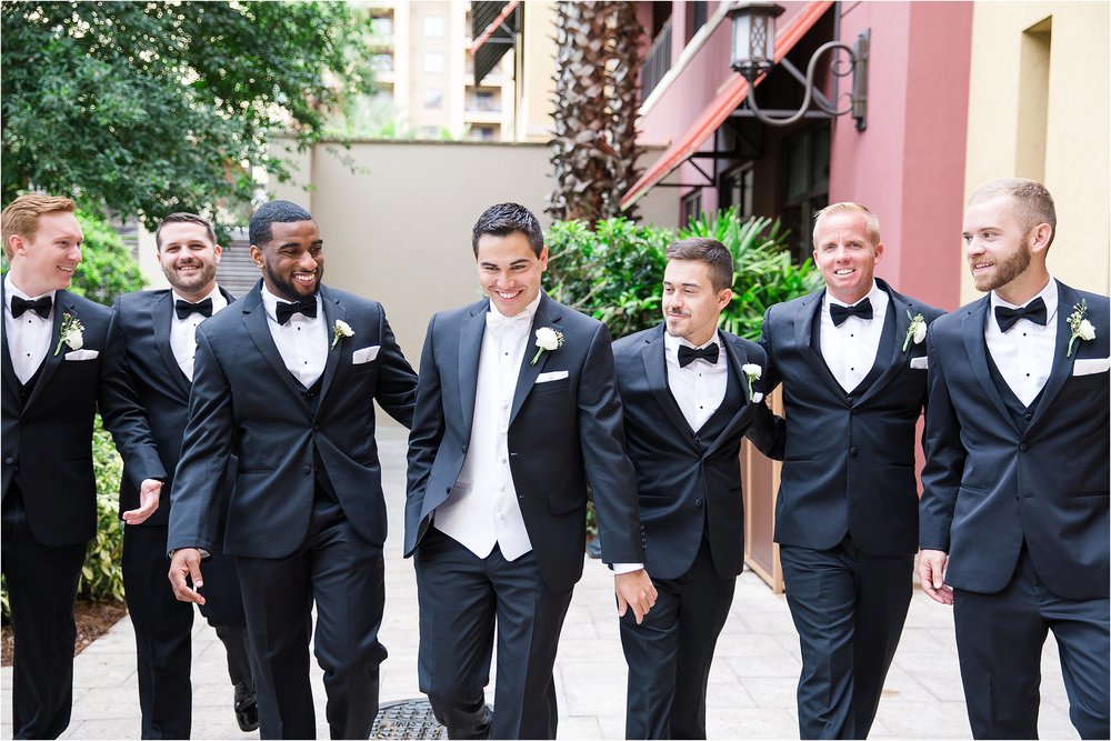 Groom portraits with ranunculus boutonniere at Wyndham Grand Resort at Bonnet Creek wedding by PSJ Photography 