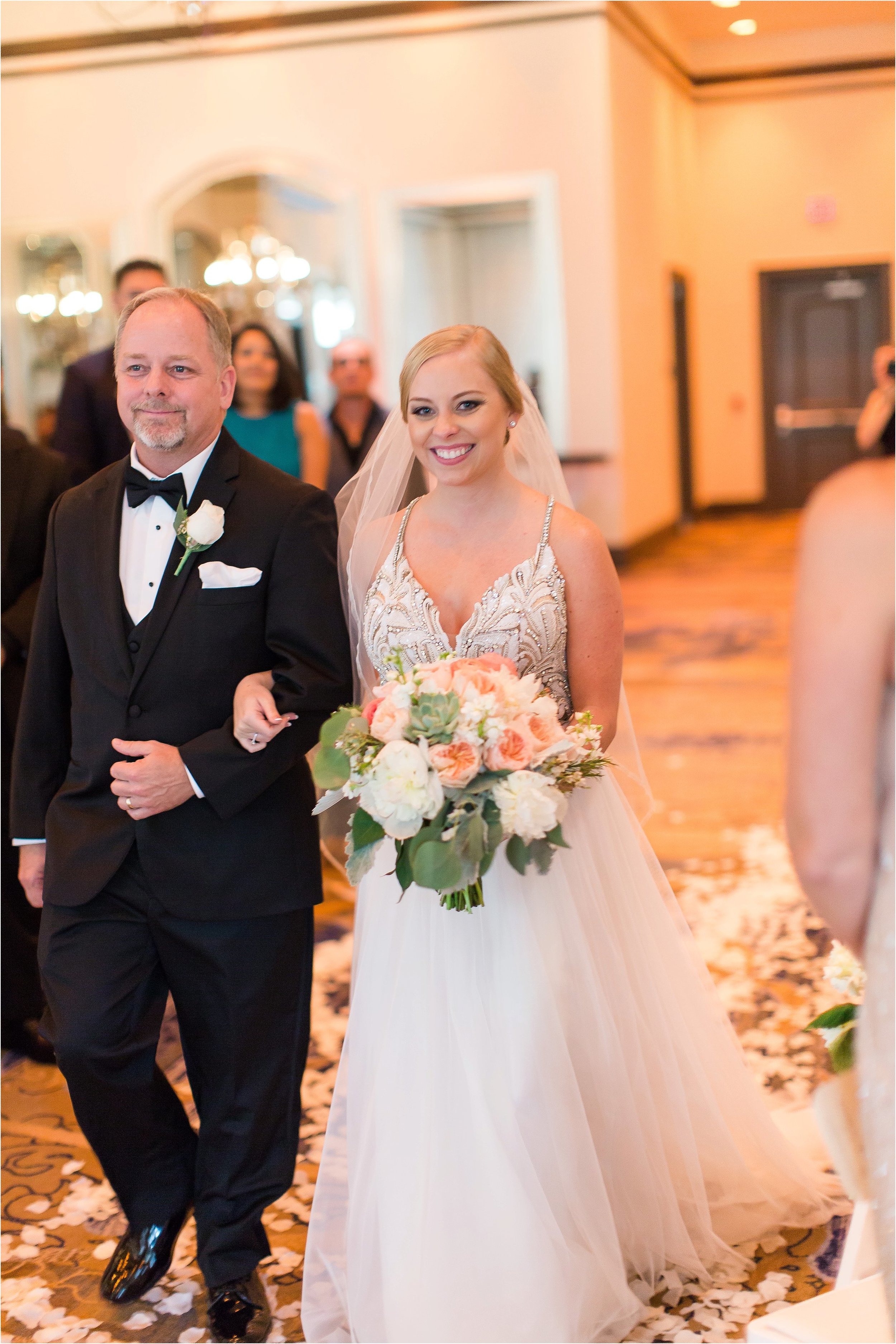 Bride walking down the aisle at Wyndham Grand Resort at Bonnet Creek Wedding by PSJ Photography 