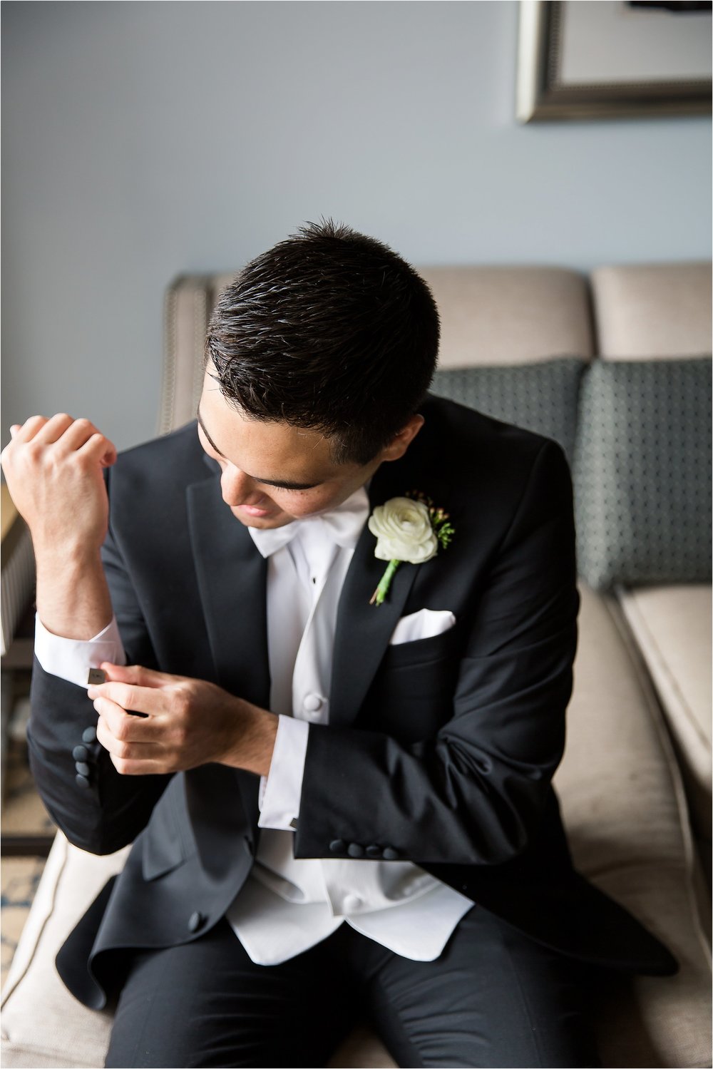 Groom Portraits in classic tux with white vest and bowtie getting ready moments at Bonnet Creek Wedding by PSJ Photography