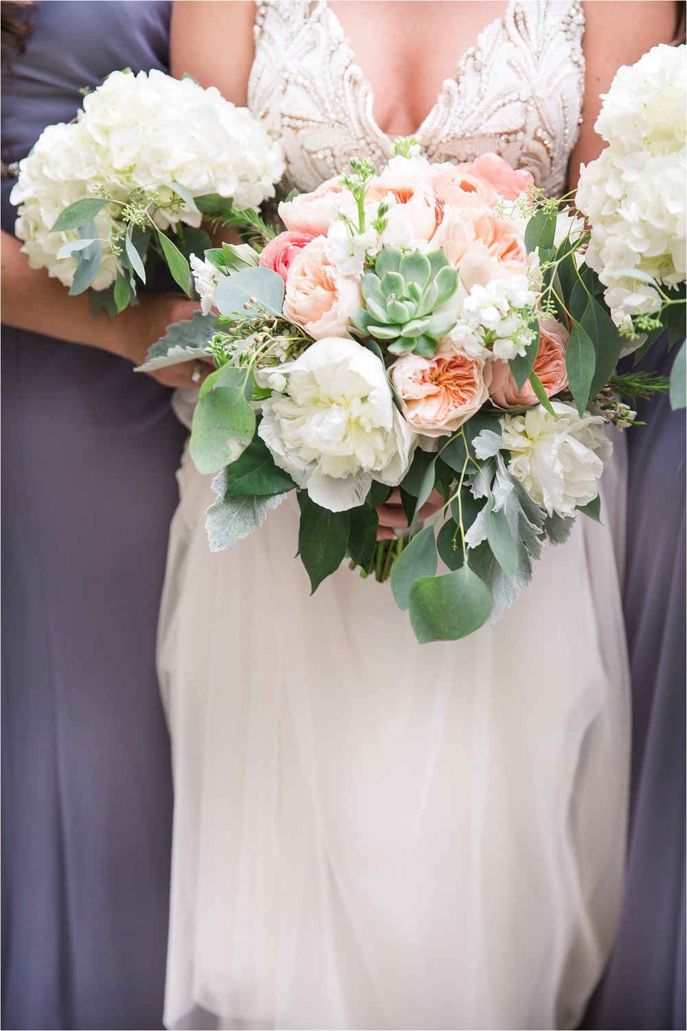 Bridesmaids in grey with white bouquets at Wyndham Grand Resort at Bonnet Creek Wedding 
