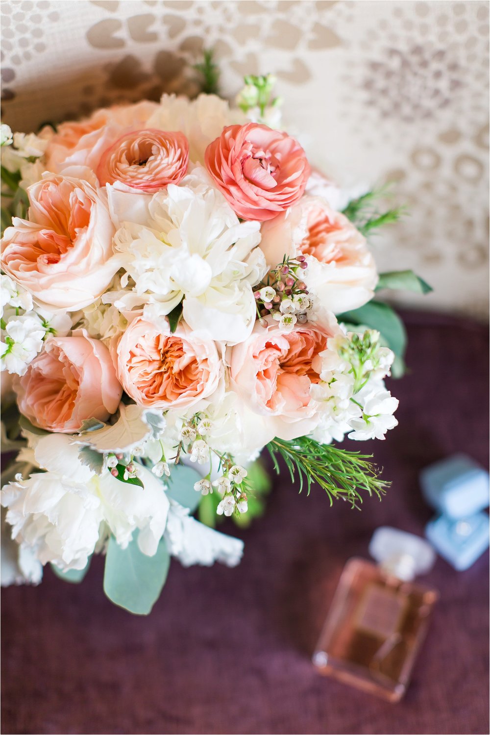 Peach garden rose and white peony bridal bouquet with ranunculus at Wyndham Grand Resort at Bonnet Creek wedding 