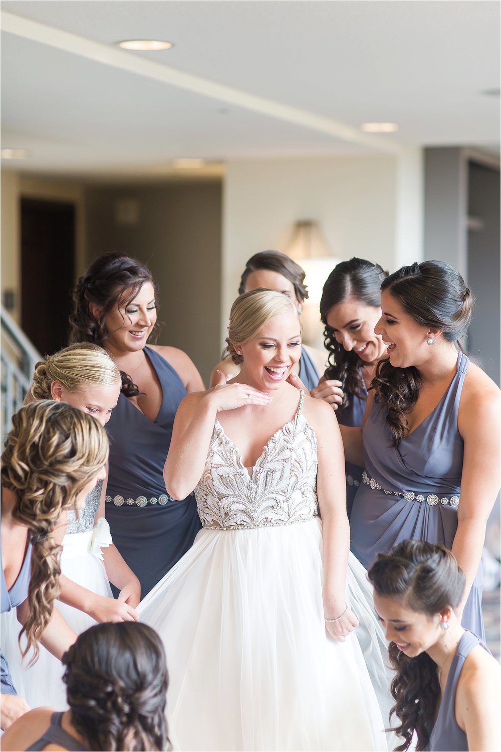 Bridesmaids getting ready in grey Chanel Mademoiselle Hayley Paige wedding gown getting ready moments at Bonnet Creek Wedding by PSJ Photography
