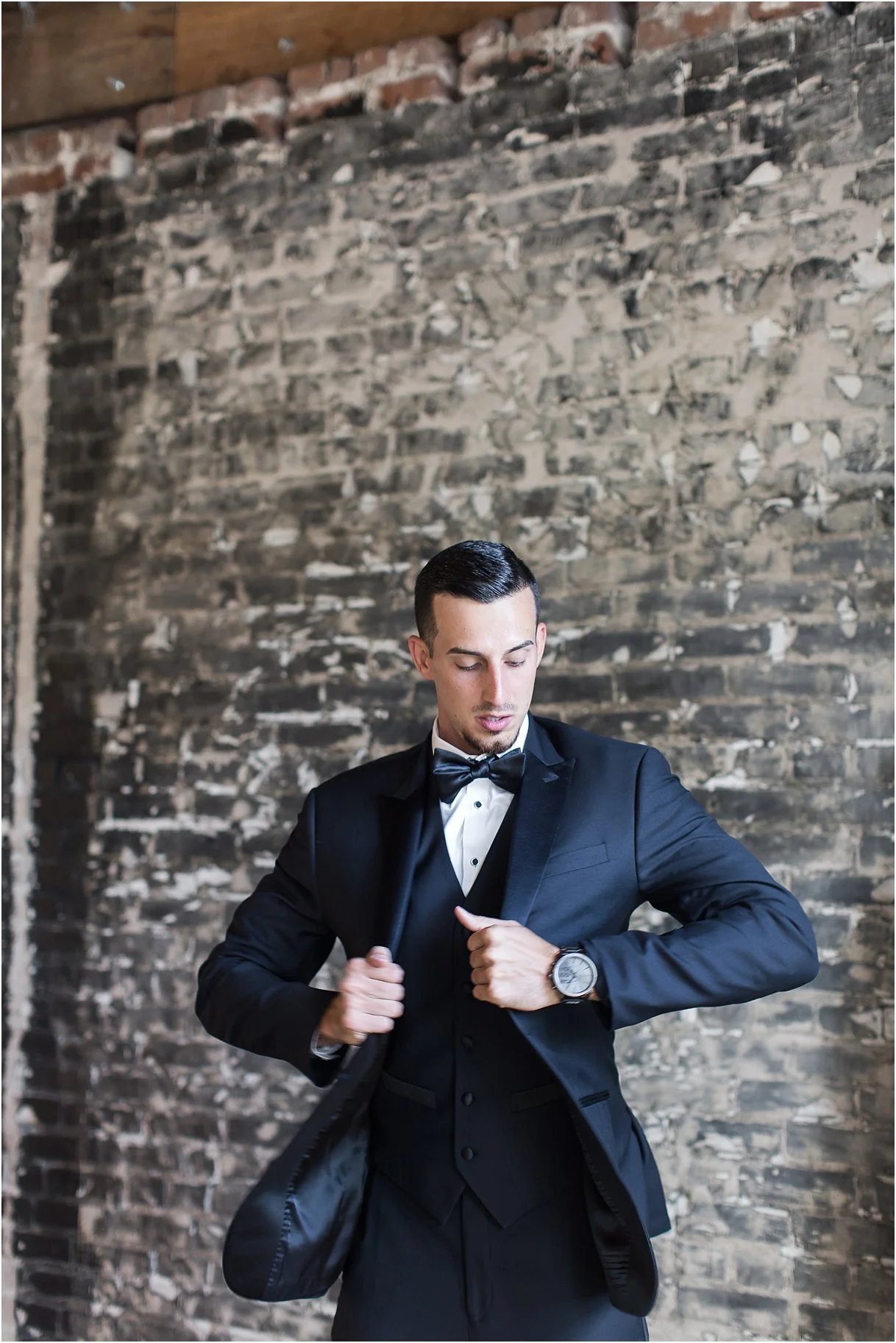 PSJ Photography - Groom getting ready in black tux and bow tie at Oxford Exchange wedding