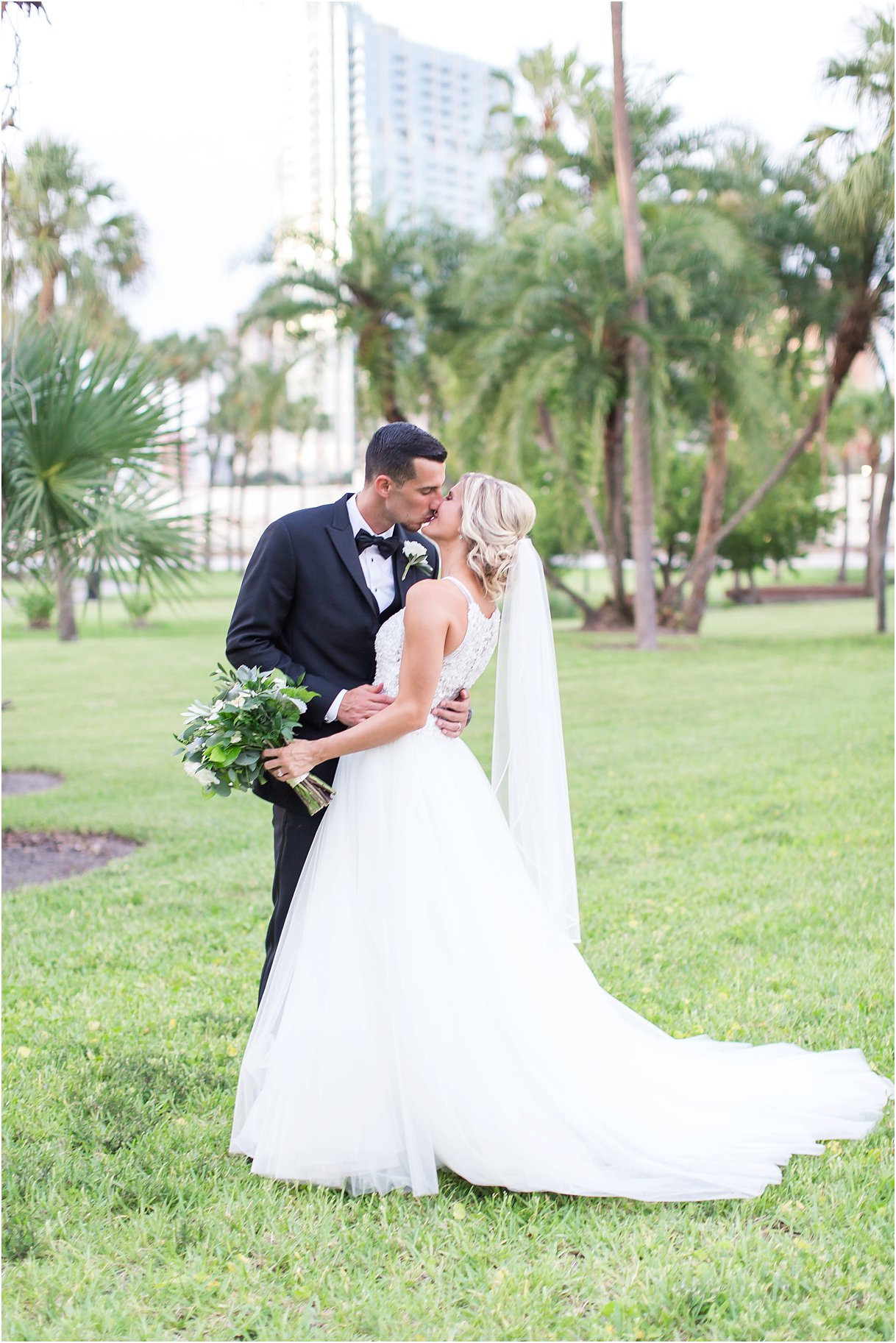 Formal Portraits at Tampa University Oxford Exchange Wedding Tampa PSJ Photography in Maggie Soterro Lisette and black tux and bow tie 