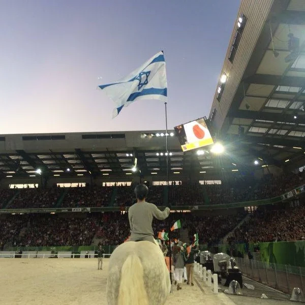 Raising the flag at the opening ceremonies of the 2014 World Equestrian Games in France