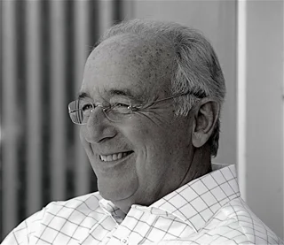 He is smiling at because you're procrastinating by reading my blog.