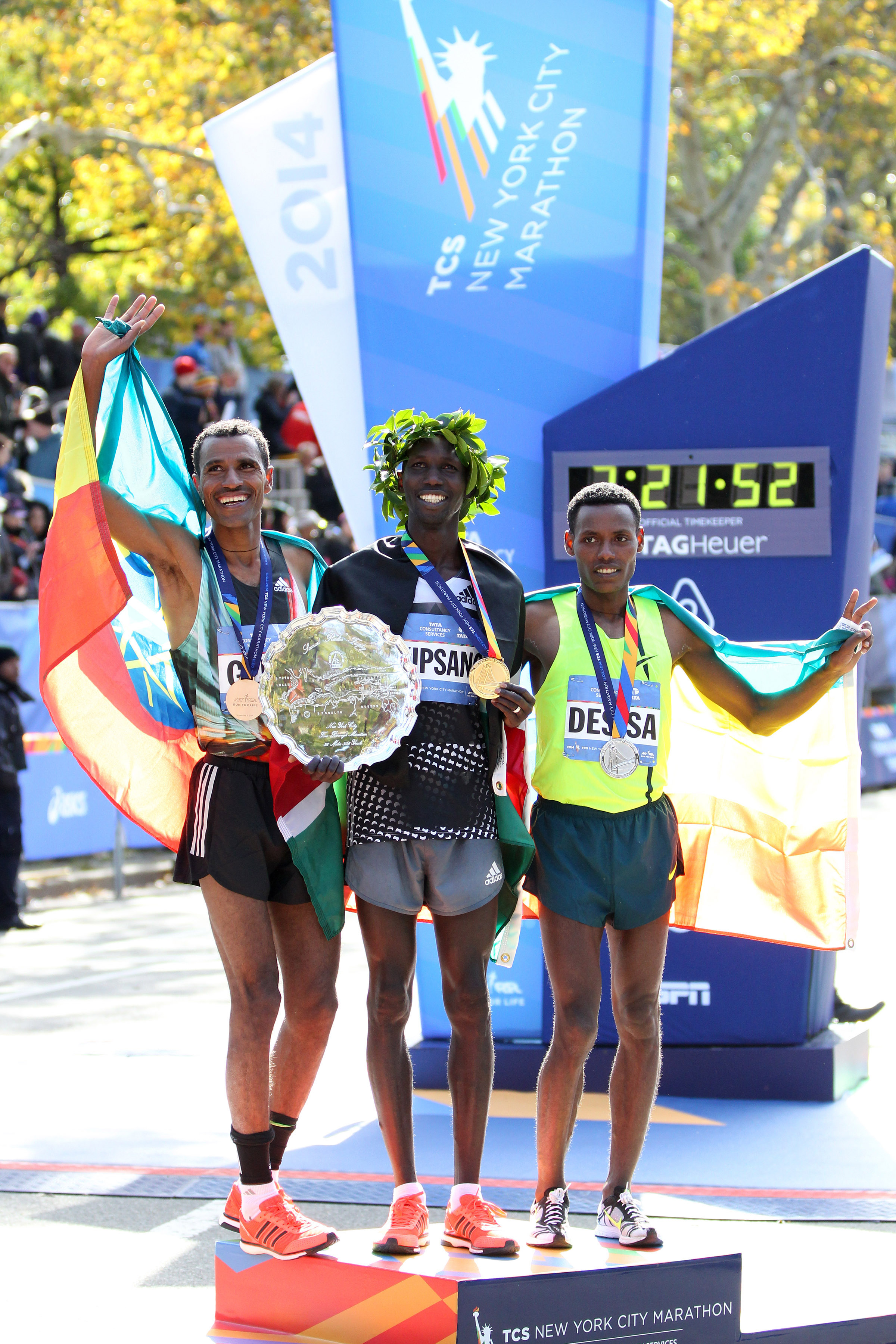 2014 TCS New York City Marathon champion Wilson Kipsang, (2:10:59), flanked by third-place-finisher Gebre Gebremariam and Lelisa Desisa Benti. (Credit: PhotoRun/NYRR)