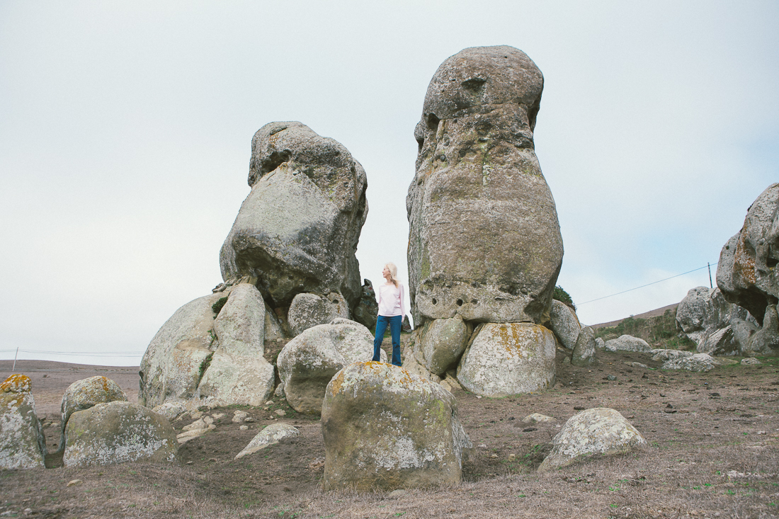She braved climbing this rock for a portrait. 