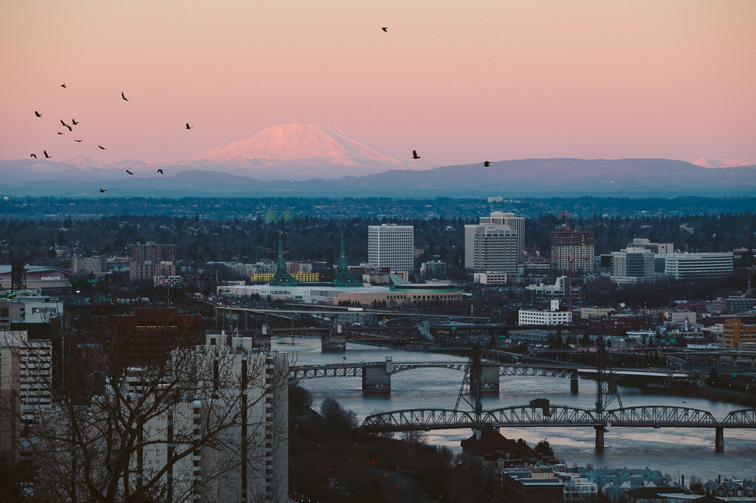 Portland, because it is a big port? The big waterway means a lot of bridges, and a great sunset with Mt Saint Helens off in the distance. 
