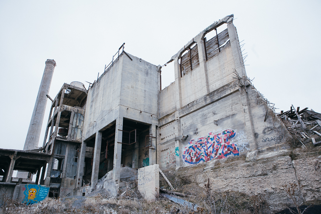 It turns out to formerly be a cement factory, and currently a canvas for graffiti. 