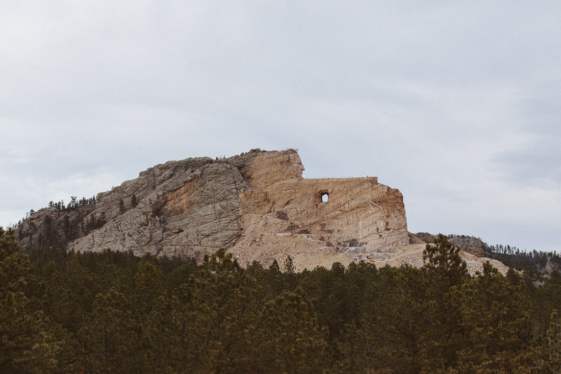 This is a monument in progress dedicated to the Native American Crazy Horse. The story is tragic, the US Federal Government betrayed and murdered him. You should read about it to make your own opinion on the topic. 