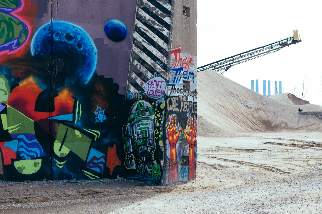 Down near the river is a flood-wall that the city has given permission to graffiti artists to paint on, aptly named PAINT LOUIS. 