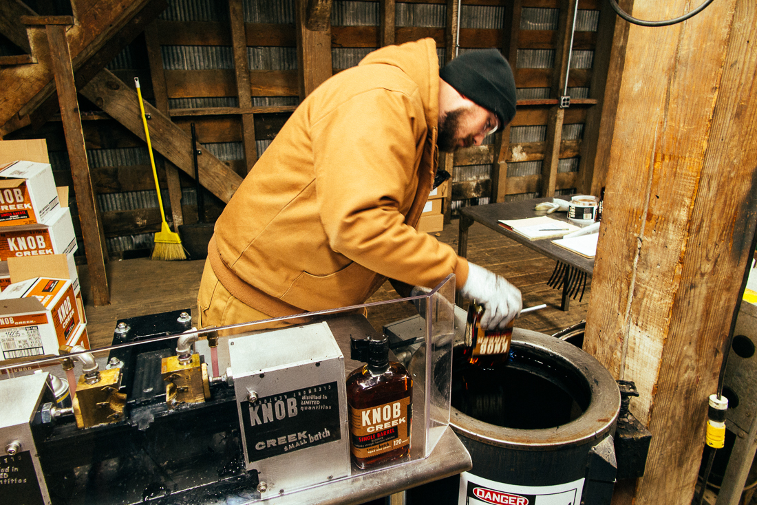 This talented worker corked and stuck a label it, then dipped 'er in wax.
