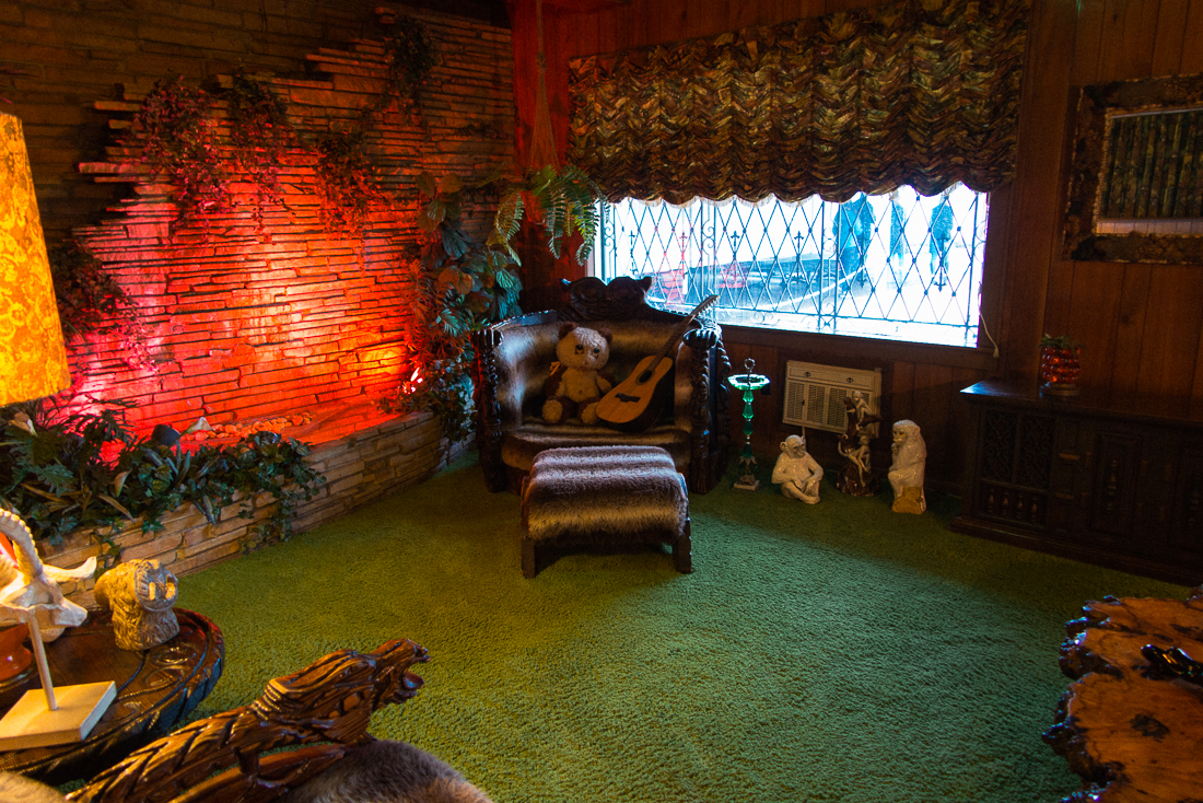 In one of his numerous living rooms was a scene full of shag carpet, which was even on the roof for nicer sound acoustics. The waterfall, just for looks I suppose.