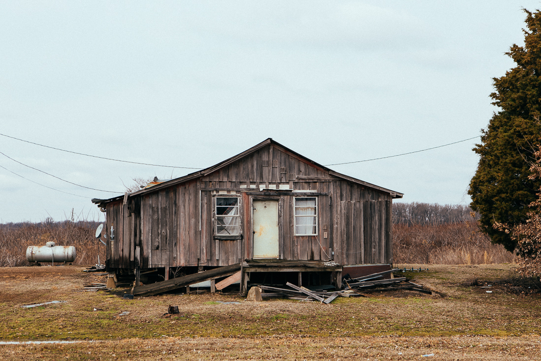 This house may appear to be a shack, but they have satellite television. ...don't be quick to judge.