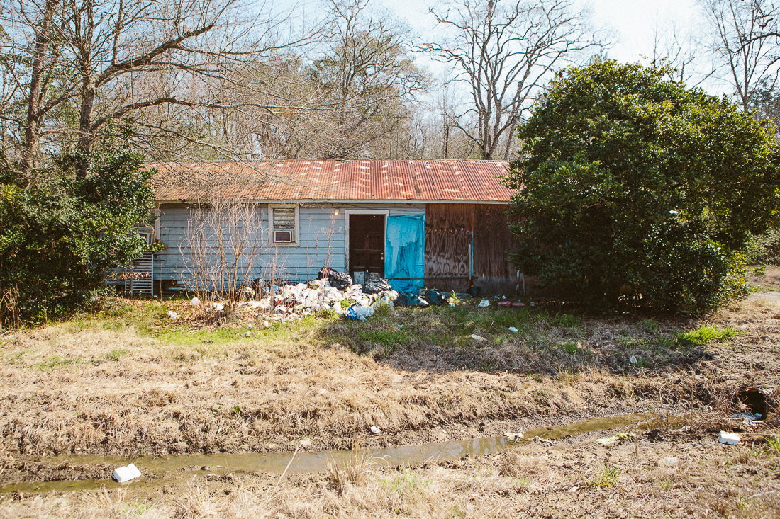 Backyard landfill. Ain't nobody got time for a trashcan. 