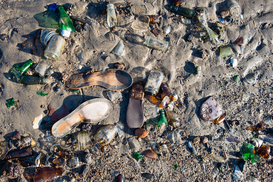 This landfill that was closed in the 1930's has been slowly eroding into the bay and littering the shoreline. Hurricane Sandy expedited this too, exposing tons of non-biodegradable items like leather shoe soles and what we came to find- prohibition era bottles.