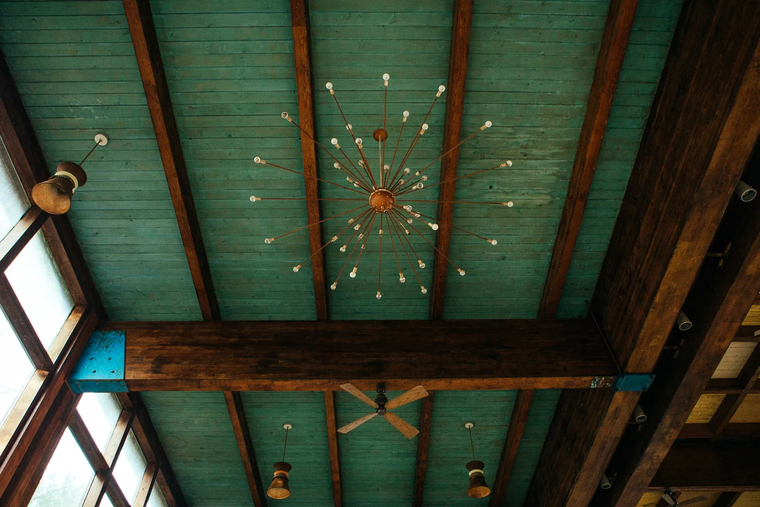 There also is still the beautiful midcentury modern chandelier and fans.