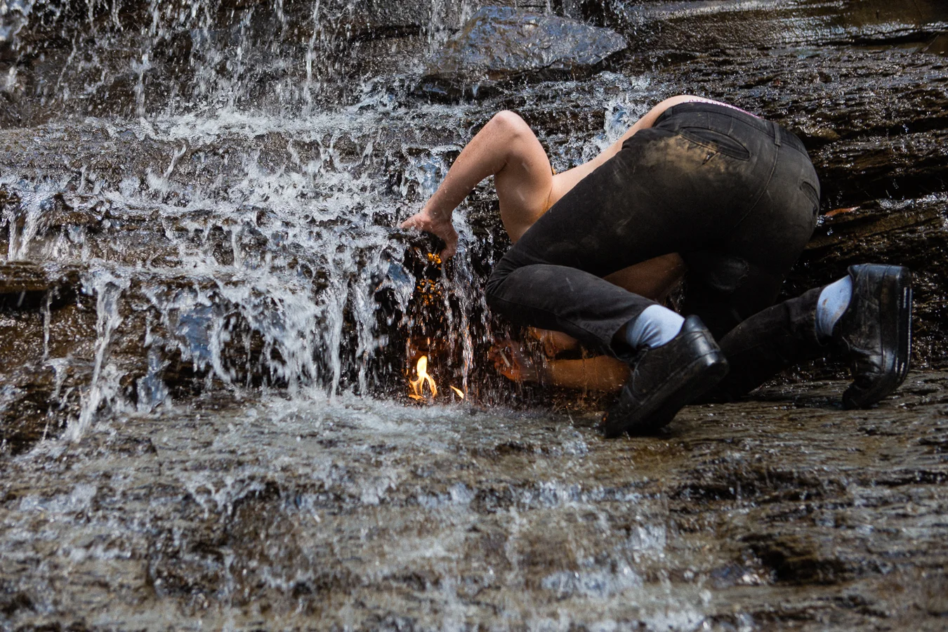 This bro claimed, "It's good luck if you light a cigarette from its flame!". He stuck his head in there, not only to soak his cig in the water, but blew out the flame as well.