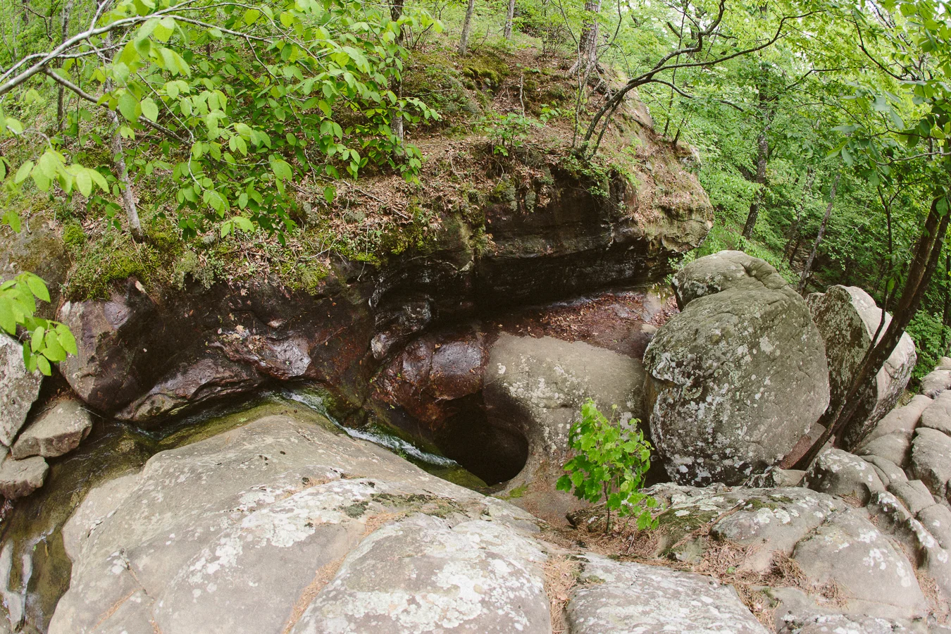 Over the centuries this creek's flow has drilled a hole straight through the rock- NEATURE.