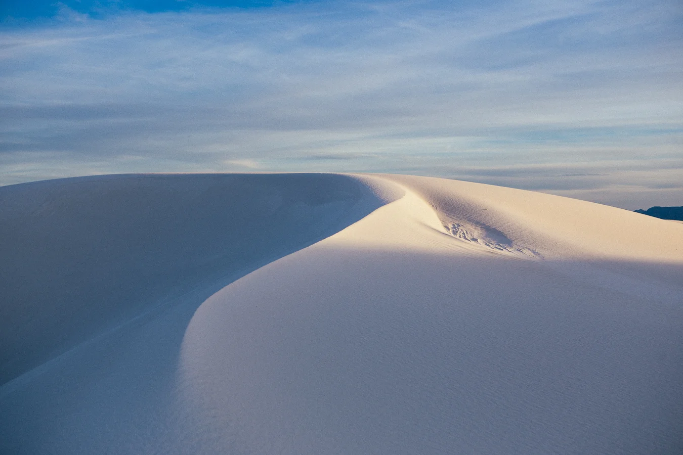 The last light on the dunes turn the white into amber and the shades to blue. Pretty pretty.