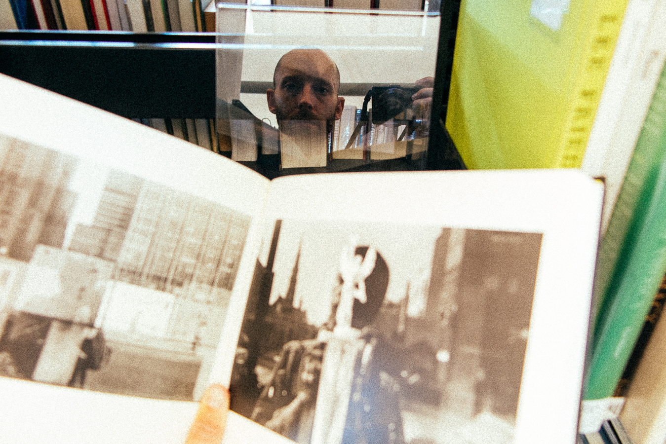 While reading a book in the library from a photographer who's done a full lifetime of self-portraits, I caught this reflection of myself. I thought it was a pretty cool moment.