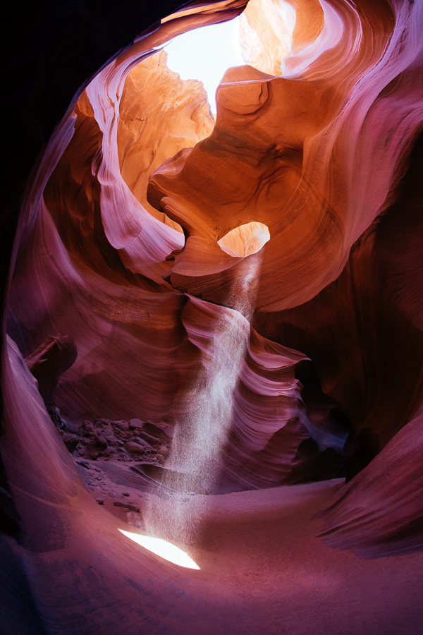 This is the moment we all hoped to capture. During the right time of year for just a few moments of the day, (if the skies are clear) the sun will pass in a unique position to peer through the tight walls of the deep canyon and create this beam of light. You can then kick up some dust to really make the spotlight come to life. ...while the fine dirt kills your camera. (winky face)