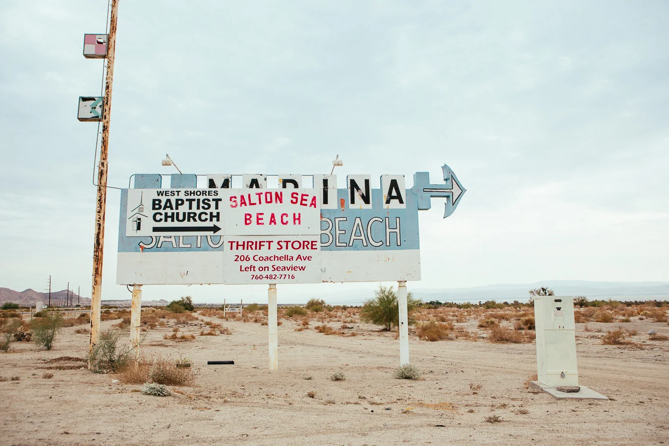 I like the detail of the arrow within the silhouette of an anchor. The craft of sign making is a lost art these days, too many easy made vinyl banners in use now.