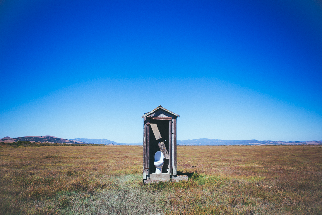 Out in this muddy marsh there's no other structure for miles. Is it an art installation, is it a redneck joke, or is it just a perfect photo op of an outhouse for me???