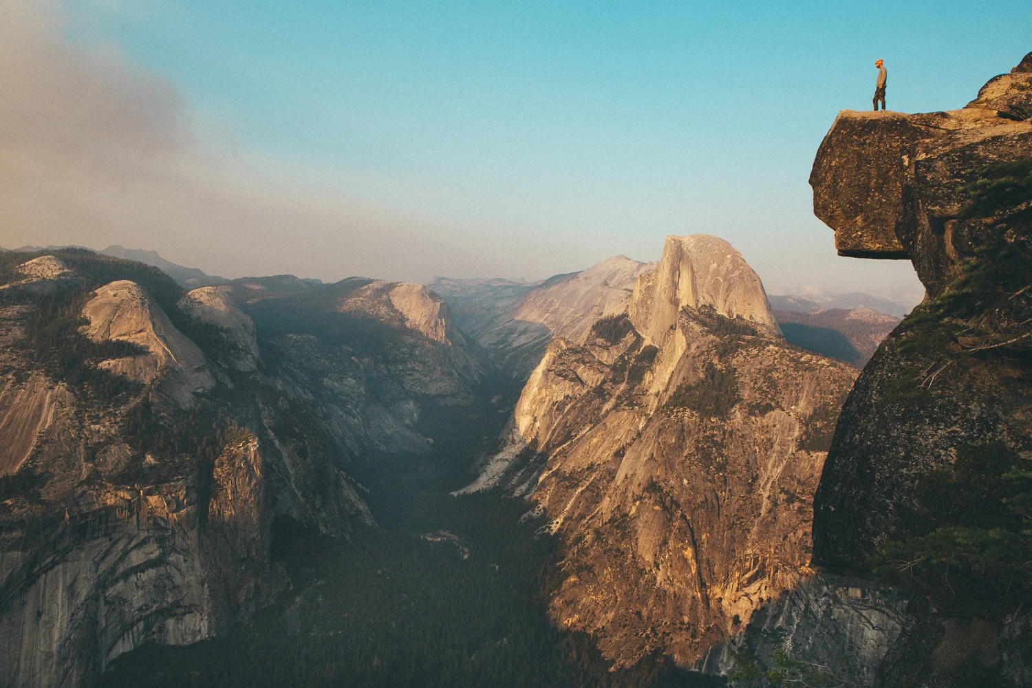 Off the main path at Glacier Point is a highly unadvised trail to the cliff's edge. (...skateboarders often turn a blind eye to the rules) At sunset I placed my camera and tripod a couple feet from the drop, snapping this breath taking self-portrait with the last light hitting Half Dome off in the background. 