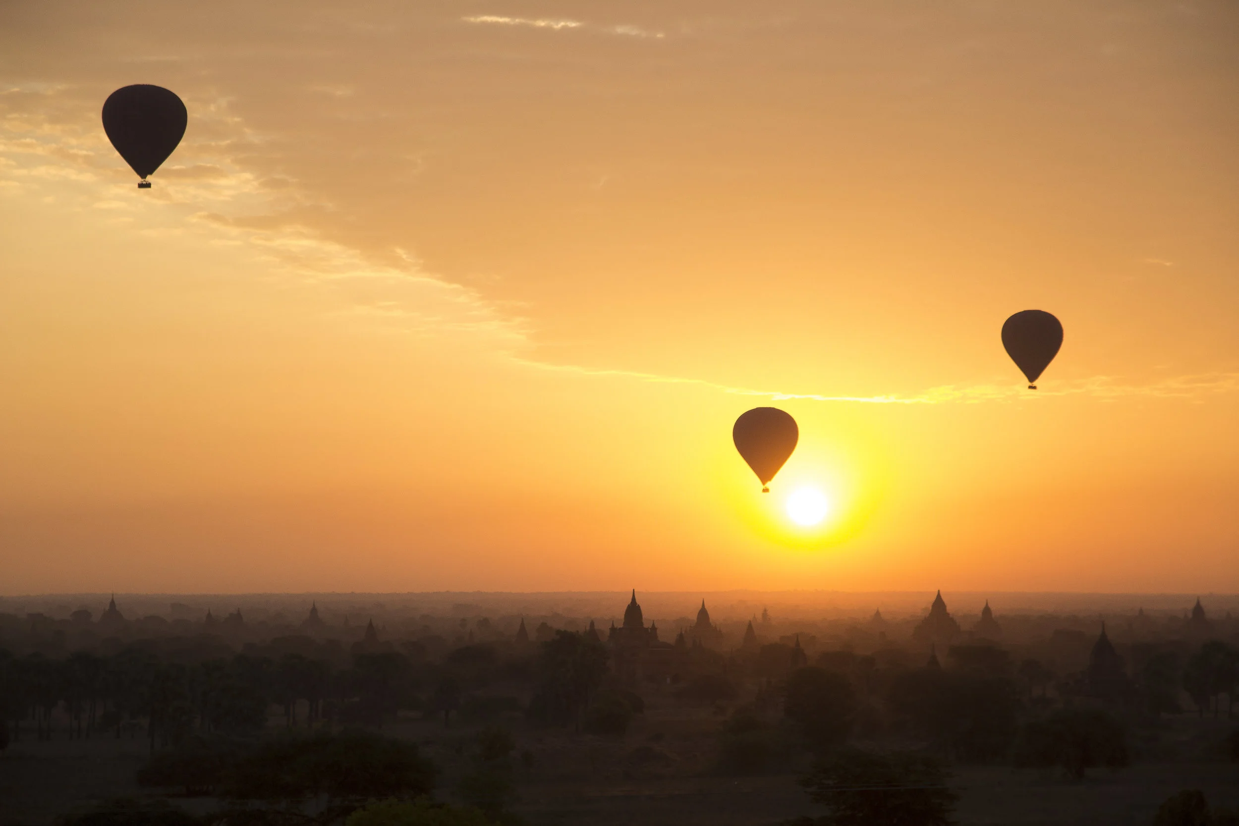 Hot air balloons float across the ancient temples of Bagan, Myanmar.