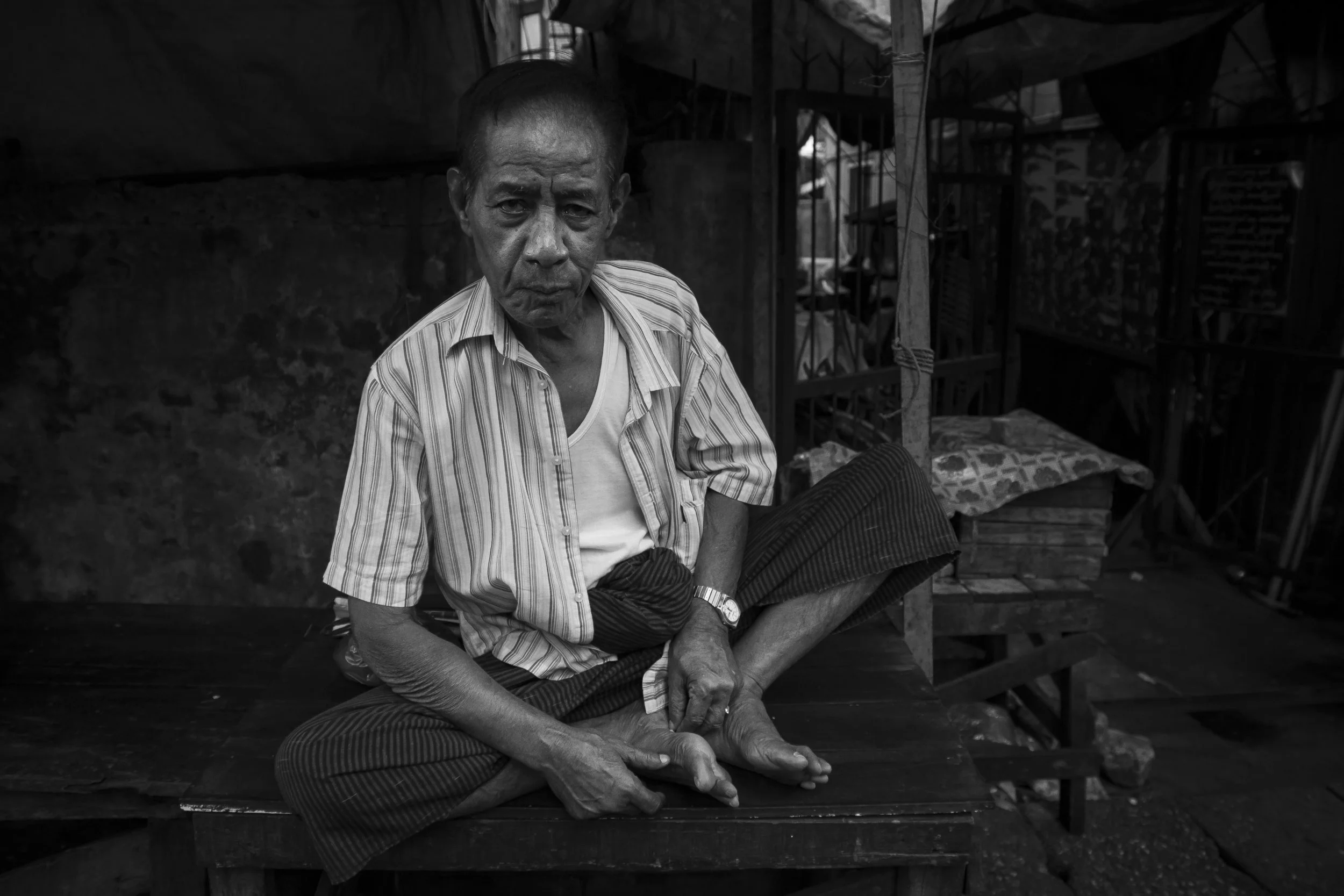 Old man in the Yangon street markets, Myanmar.