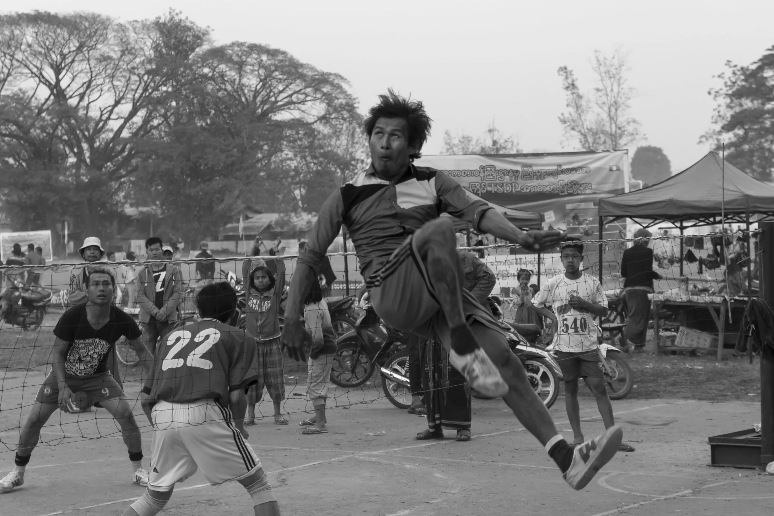 A chinlone player showing off his athleticism in Hsipaw, Myanmar.