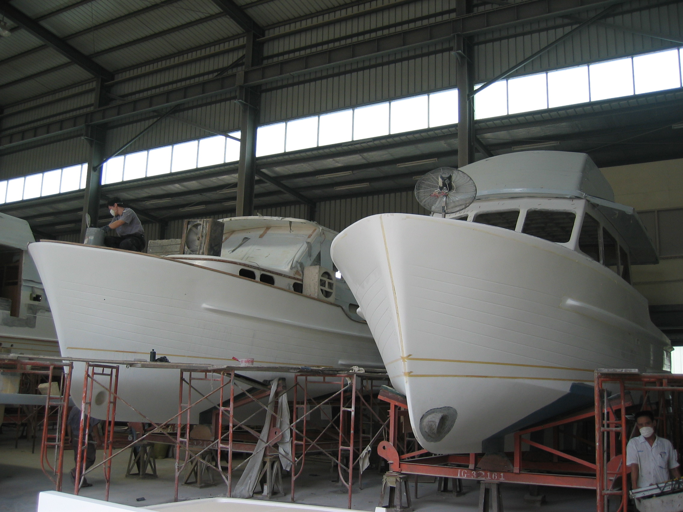 An Island Gypsy 32 and Gourmet Cruiser 32 under construction at Jet Tern Marine Ltd in Dong Guan Southern China. 2005.