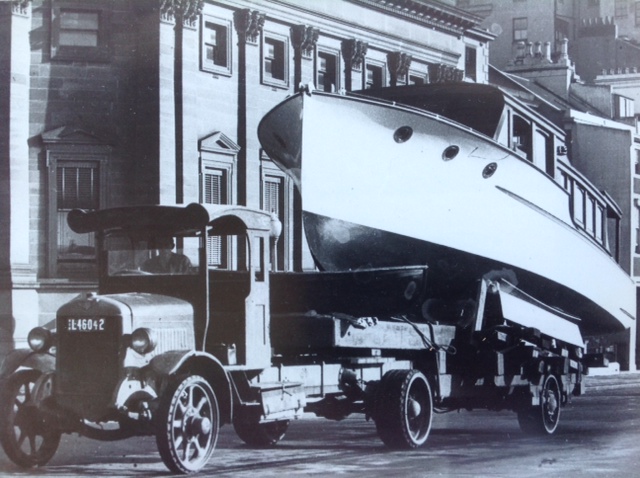 "Iolanthe" 36' Bridge Deck Motor Cruiser designed and built by L. Halvorsen for Mr. A.G Wilson and completed in June 1933. Photo taken in Macquarie Street on her way to the Sydney Royal Easter Show. Job number 103.