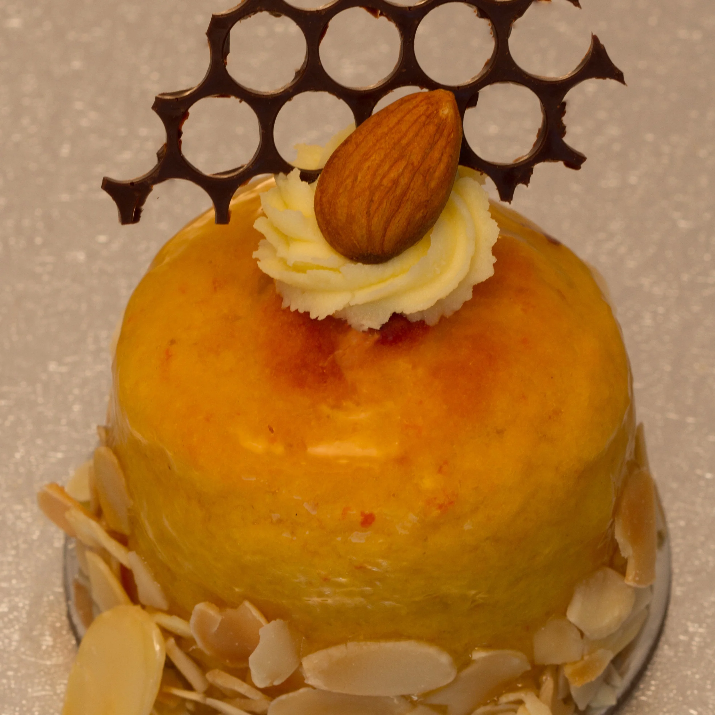 A classic flourless orange cake made with loads of fresh orange and almond meal, sliced and topped with chocolate ganache or marmalade glaze.