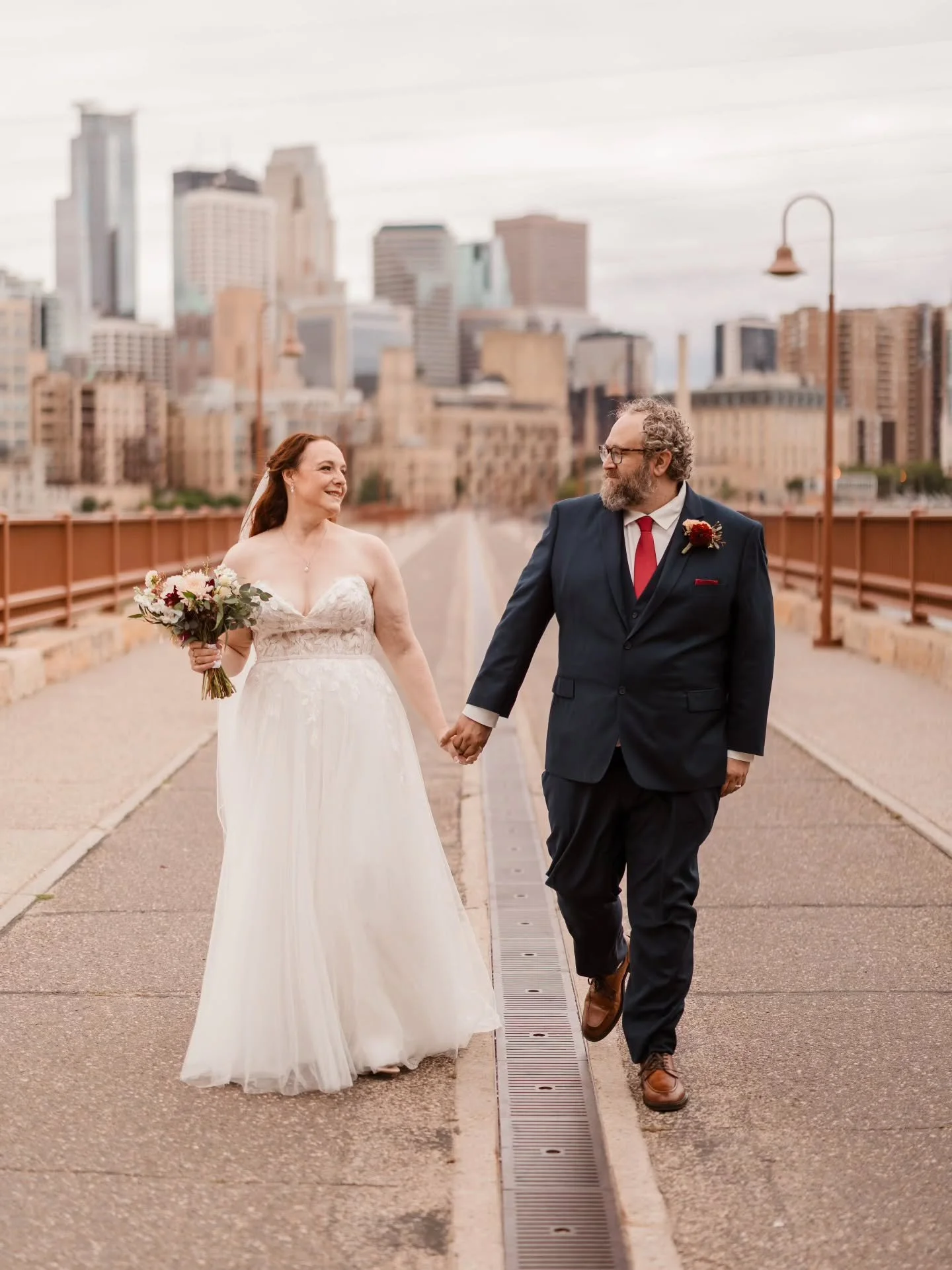 From their heartfelt first look down the aisle to their travel-inspired reception, Liz + Erik&rsquo;s wedding day was filled with intentional details and joy.

They married at St. Lawrence Catholic Church in Minneapolis, stopped for portraits at Ston