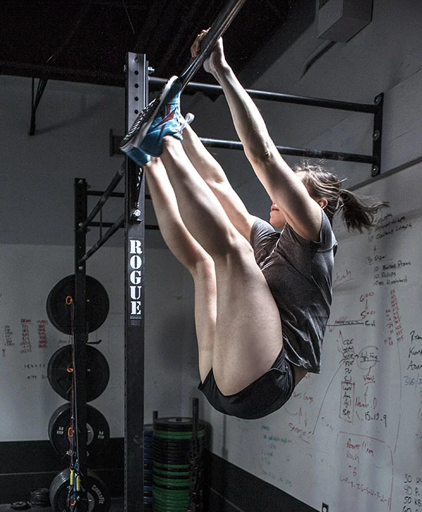 It was at this exact moment that CrossFit legend Julie Foucher realised she'd made a massive error on her toes to bar... she didn't put her thumbs around the bar!! Tut tut.