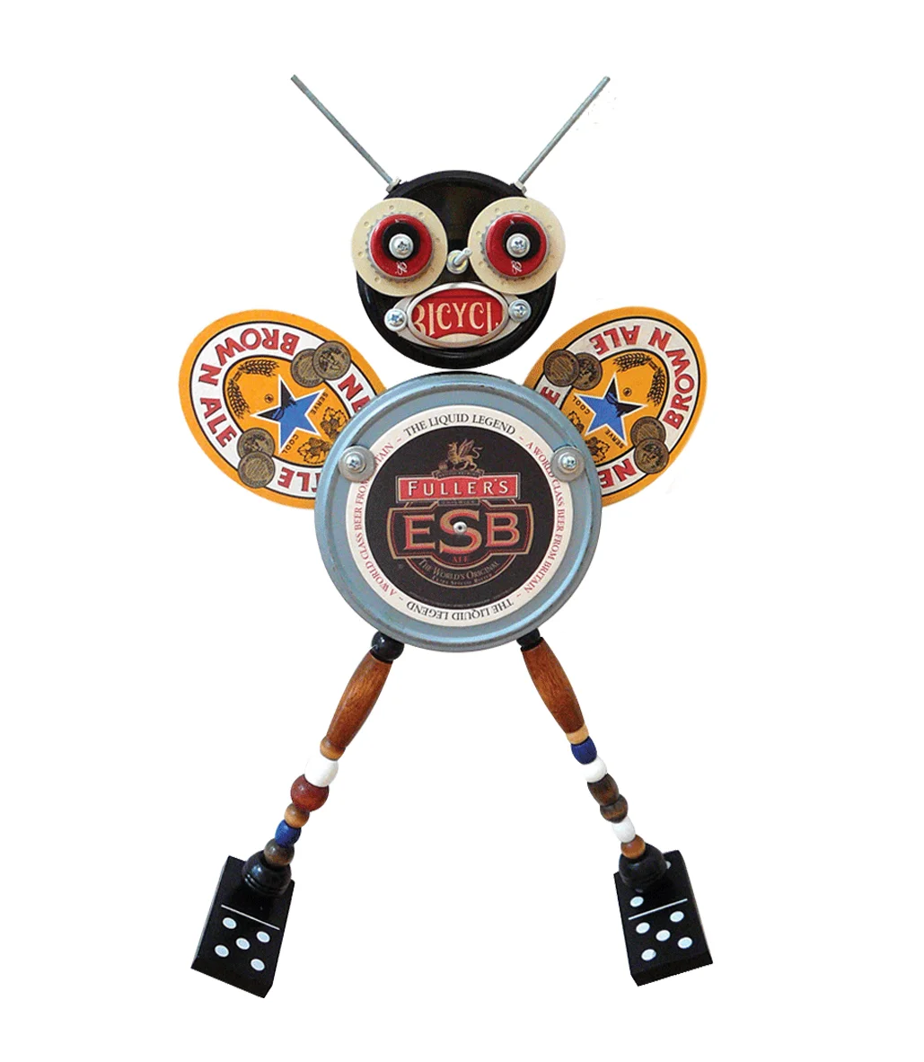 This little guy I call Bicycle Bee. He's made out of an old movie reel case, jar lids, poker chips, beer coasters, wood beads, dominoes, nuts and bolts and bottlecaps. Just one of my many assemblages I've created for fun in my spare time.