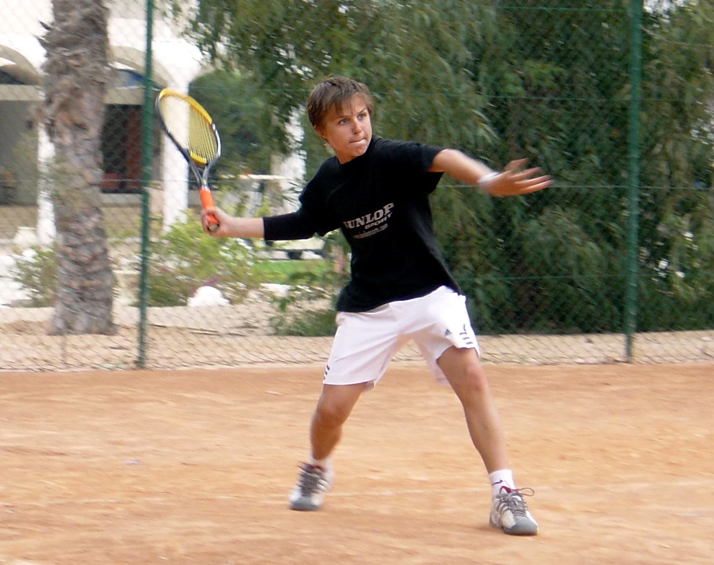 A young Nikki already playing on the red clay.