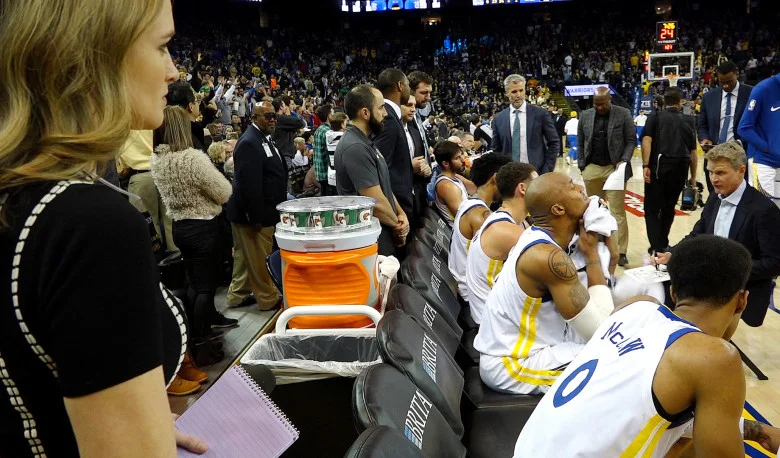 NBC Sports Bay Area sideline reporter Kerith Burke, left, observes from the sideline during a timeout in the Golden State Warriors NBA game against the Memphis Grizzlies at Oracle Arena in Oakland, Calif., on Wednesday, Dec. 20, 2017. Burke replaced Rosalyn Gold-Onwude, the former Stanford basketball standout who left NBC to accept a full-time NBA position with Turner Sports. (Jane Tyska/Bay Area News Group)