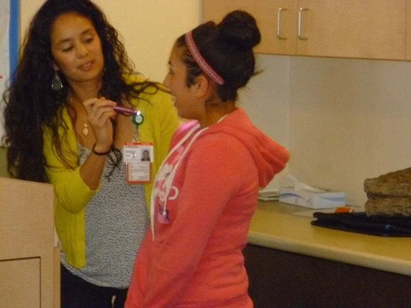Kristina Escoto checks a student’s swallowing