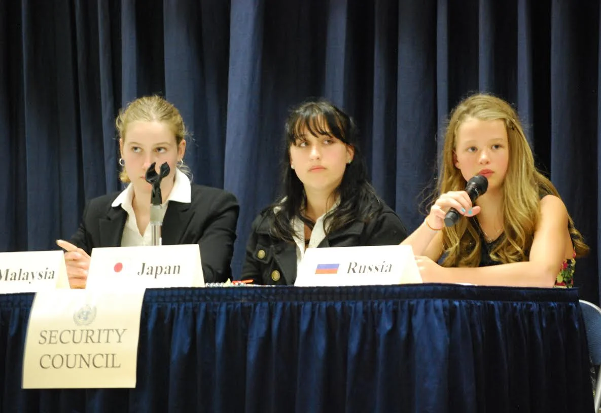 Representatives in the Security Council from Malaysia (Josie Ertl), Japan (Yvonne DiGirolamo), and Russia (Delaney Horner) answer questions posed to them by the press.