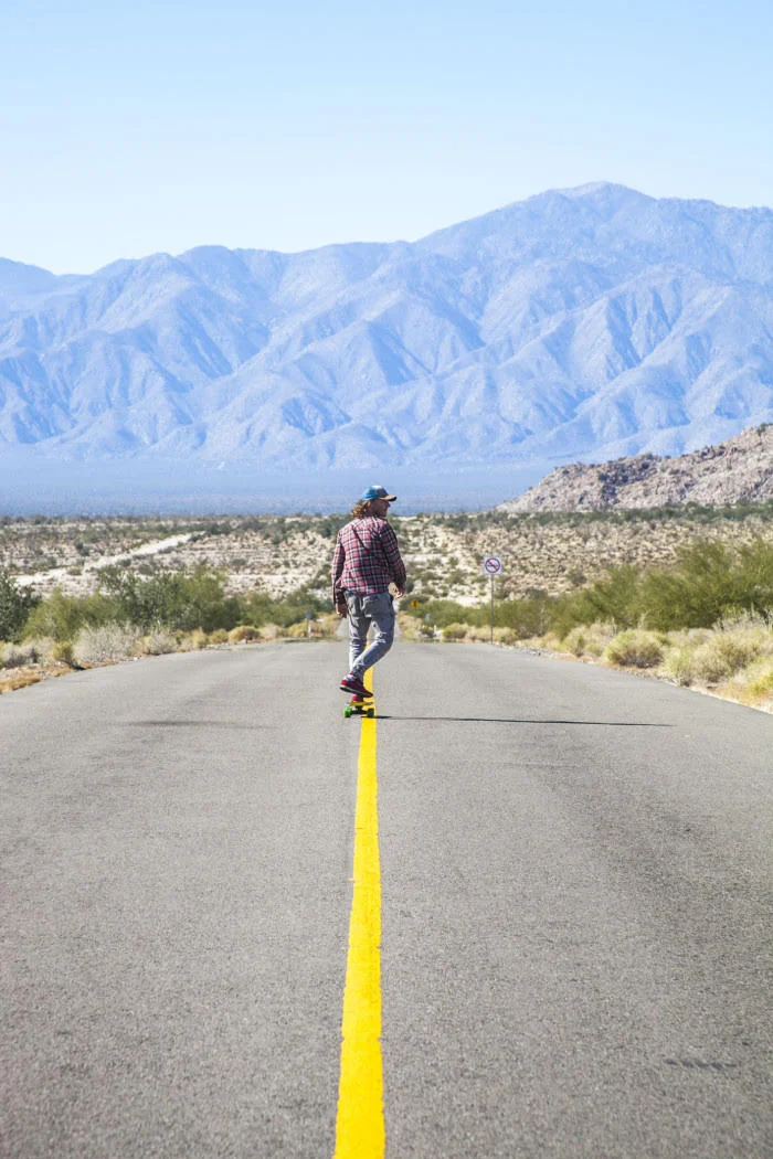 Connan stretching his legs down a Baja California road.