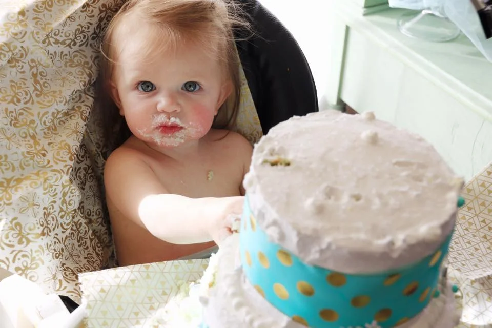Ava sweetly tasting and enjoying her cake!