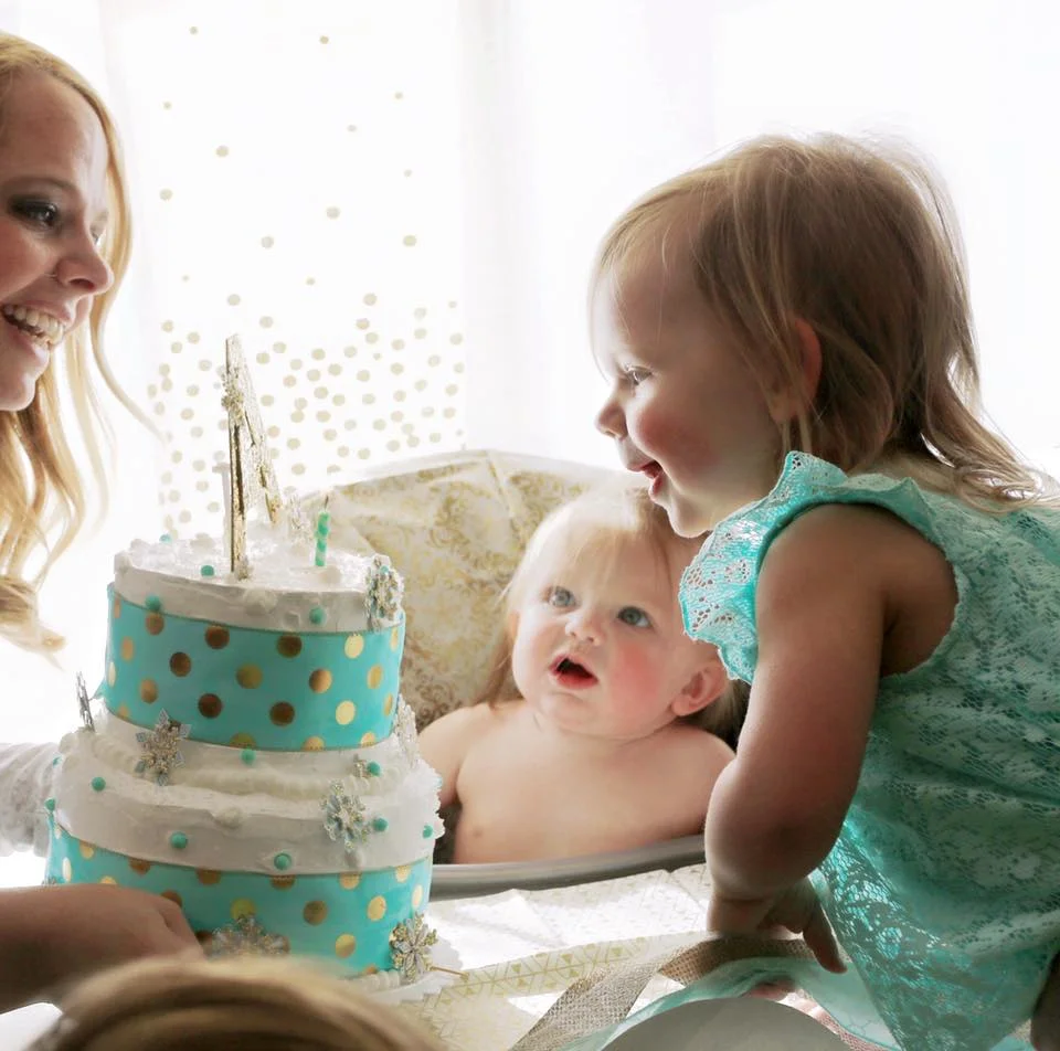 Emily helping Ava blow out her candle!