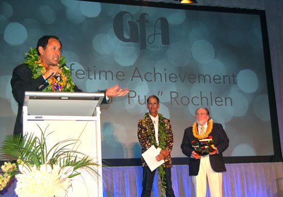 David “Pua” Rochlen of Surf Line Hawaii/Jams World was the winner of the Lifetime Achievement Award at the reinstated Governors Fashion Awards ceremony that took place Oct. 30 at The MODERN Honolulu. Longtime fashion veteran Dale Hope, in a vintage 1965 Sandwich Isles tapa-print jacket presented the award with Gov. Neil Abercrombie. — Nadine Kam photos