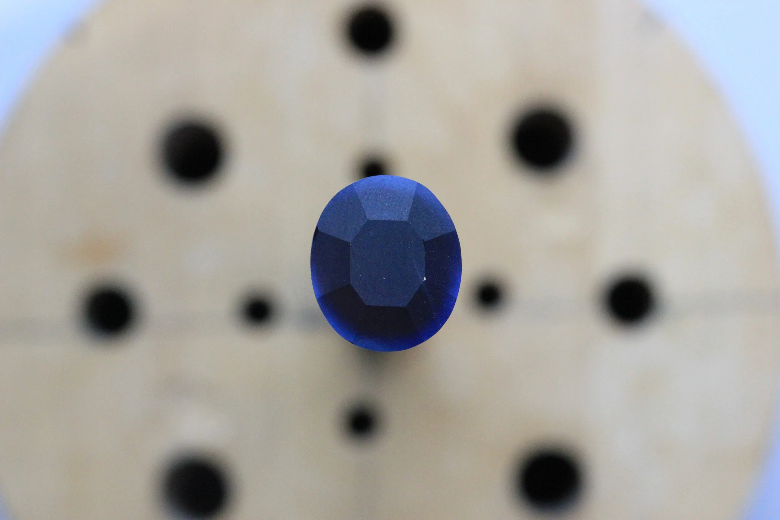 NOTE * gem color cannot be assessed accurately while the gem is in progress on the stick. Sapphires in particular - when unpolished as in this photo - appear more saturated and opaque under these conditions. 