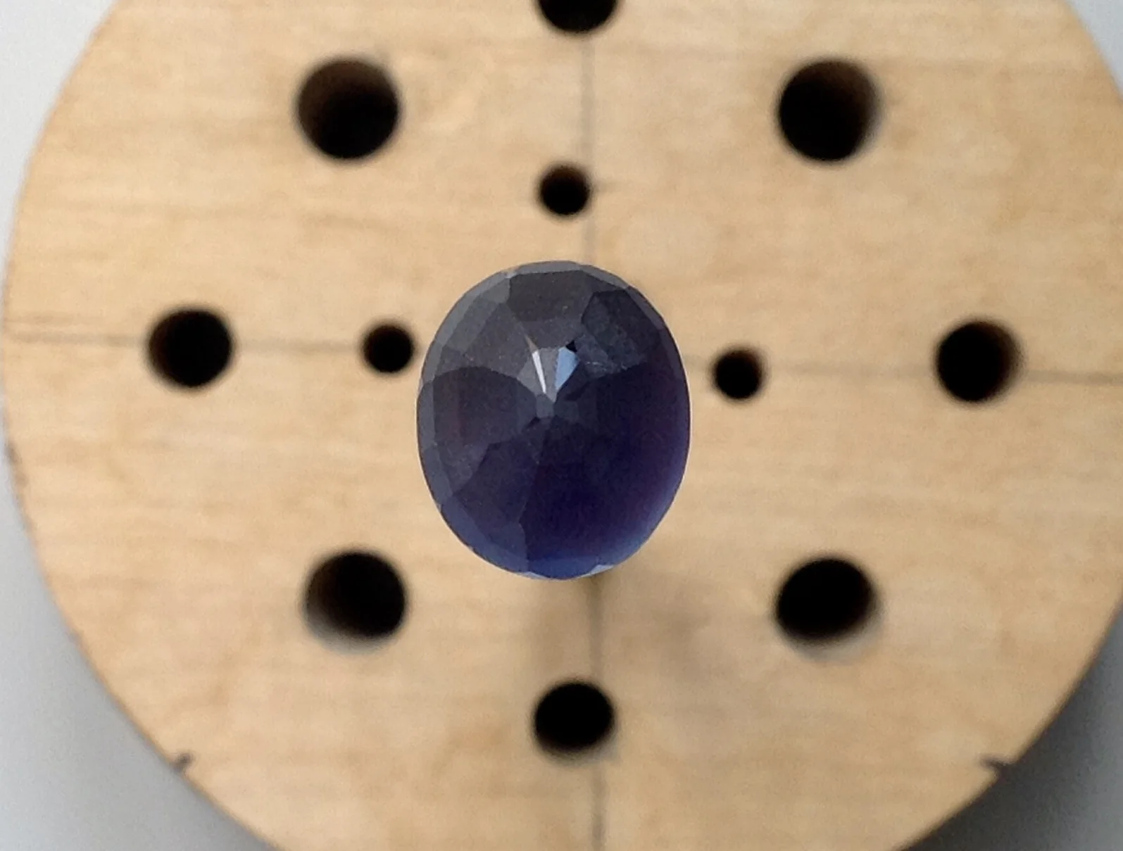 NOTE * gem color cannot be assessed accurately while the gem is in progress on the stick. Sapphires in particular - when unpolished as in this photo - appear more saturated and opaque under these conditions. 