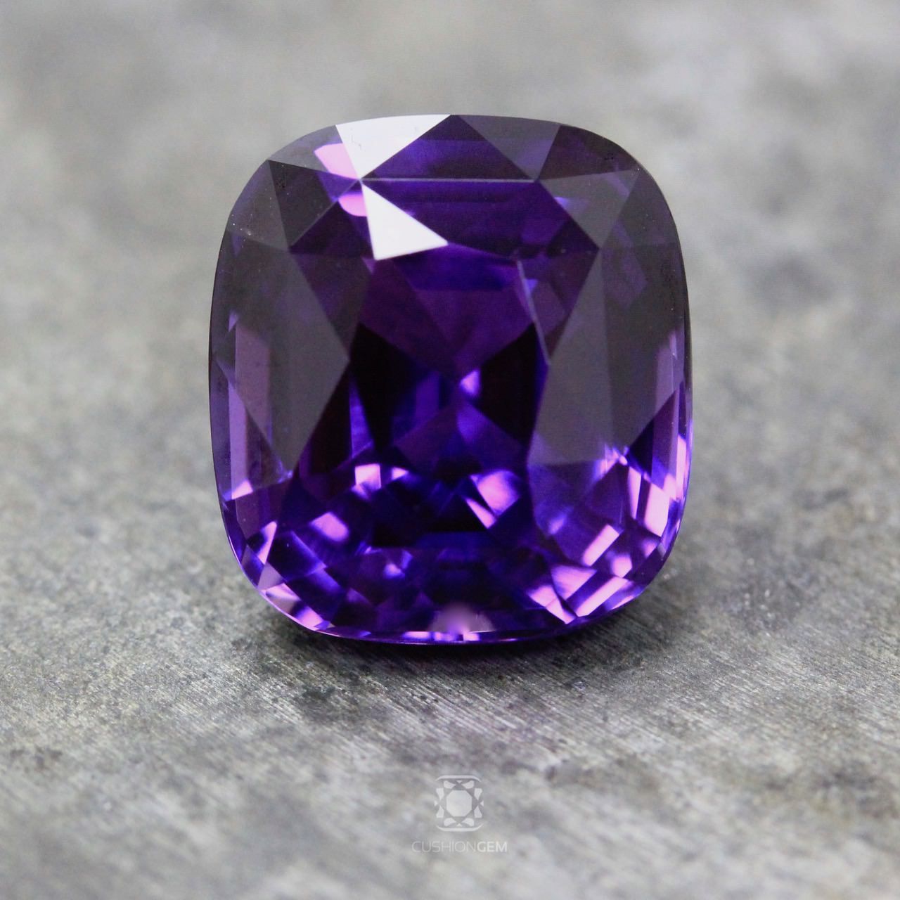 A magnificent cushion purple sapphire